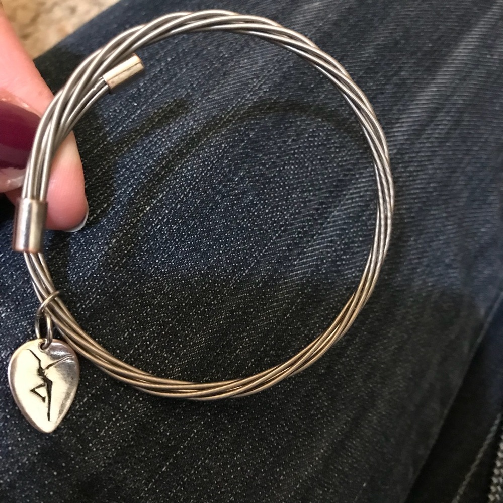 Guitar string bracelet w/ DMB Firedancer pendant.